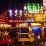 A brightly lit, jungle-themed restaurant in Phuket with people enjoying their meals