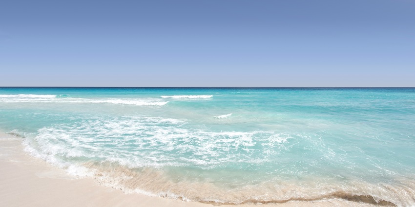 A serene view of turquoise-blue waters meeting the pristine golden sands at Phuoc My.