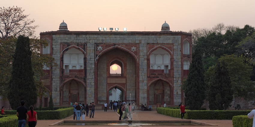 Scenic image of the Humayun’s tomb entrance and the moon in the majestic city of Delhi