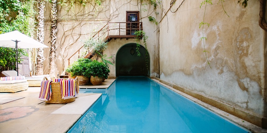 A relaxing poolside at Pink Pearl Resort and Fun City, Jaipur, offering fun and leisure for all.