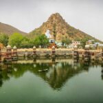 View of the Palace surrounded by water, a popular tourist attraction in Alwar