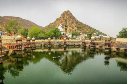 View of the Palace surrounded by water, a popular tourist attraction in Alwar