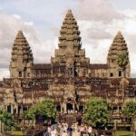 Angkor Wat reflected in a tranquil pool of water, one of the best places to visit in Cambodia