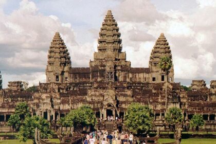 Angkor Wat reflected in a tranquil pool of water, one of the best places to visit in Cambodia