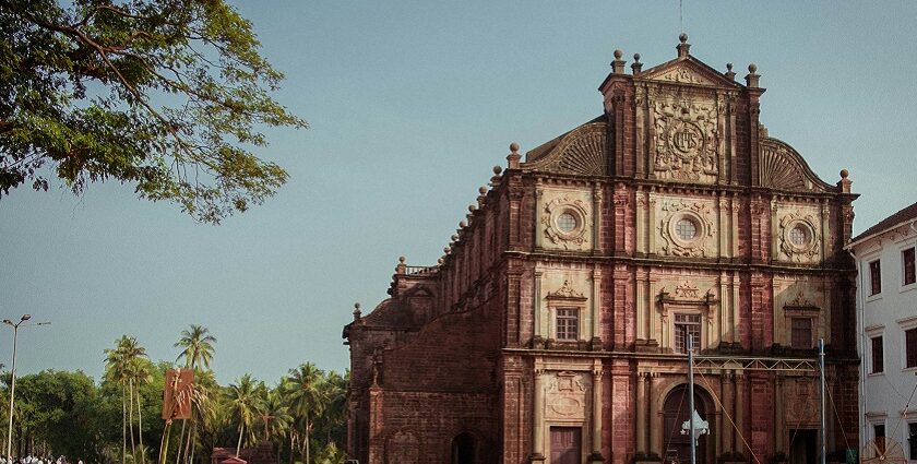 A glimpse of an iconic church adorned with shades of red and surrounded by people.