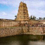 A glimpse of a famous temple in the region of Madhya Pradesh surrounded by azure waters.