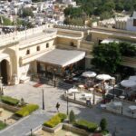 Udaipur Palace, with ornate architecture, is one of the best places to visit in Udaipur at night.