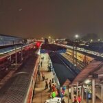 A night shot captured of Ambala Cantt station with a crowd on platform.