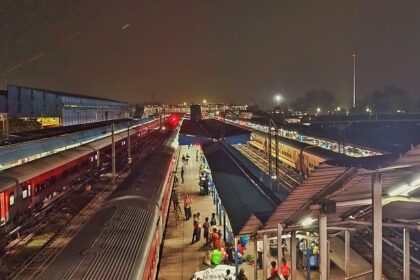 A night shot captured of Ambala Cantt station with a crowd on platform.