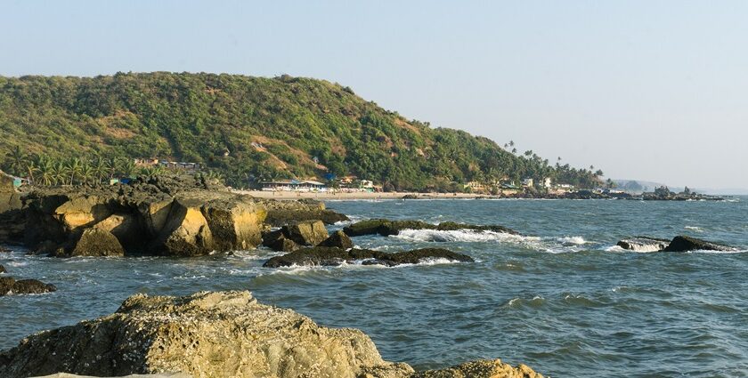 A picture of a beach with an island visible in the background