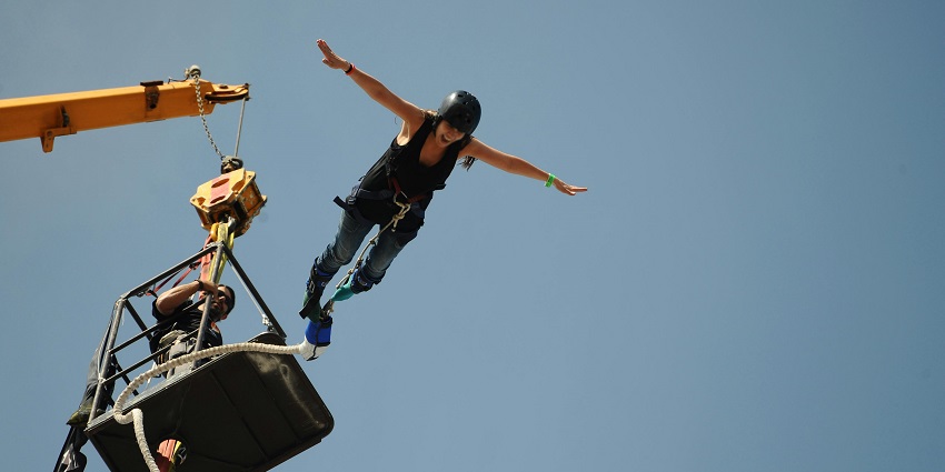 Bungee Jumping in Kathmandu with a person mid-jump from high altitude of around 70 metres.