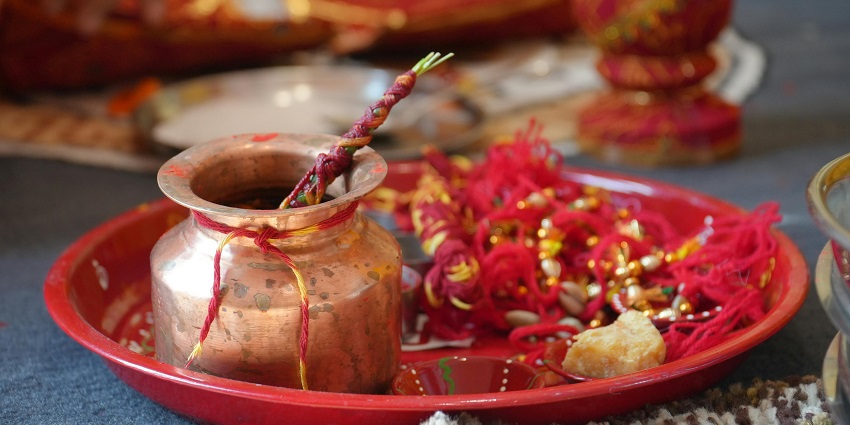 Image of a colourful pooja thali filled with traditional items for Hindu worship rituals.