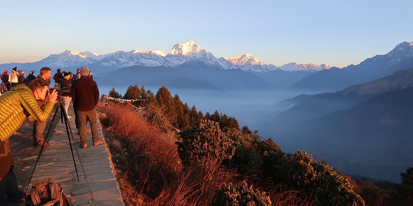 A picture of people capturing the sunset at one of the best places to visit in Nepal for couples