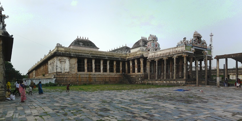 A frontal view of a historical Shiva temple in Delhi with a wide compound in front
