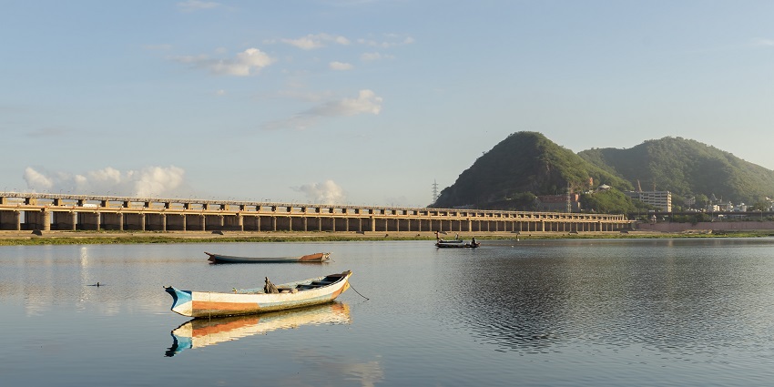 The view of Prakasam Barrage over a huge river, for shopping in Vijayawada and it is in the form of a big mound.