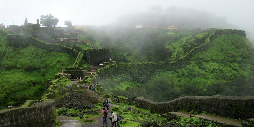 The misty view of the fort surrounded by lush greenery makes this a historic attraction