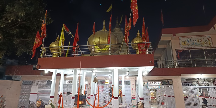 A sacred temple in Bharatpur, believed to be self-manifested, adorned with vibrant decorations during festivals.
