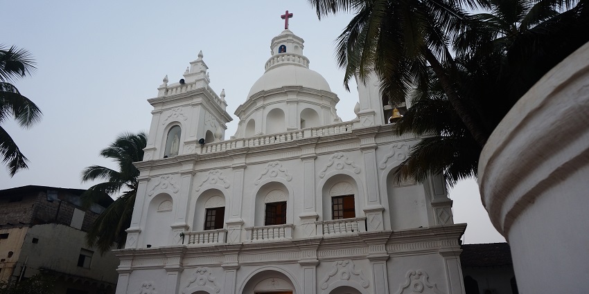 St. Alex Church features a striking facade, elegant altars, and intricately carved woodwork.