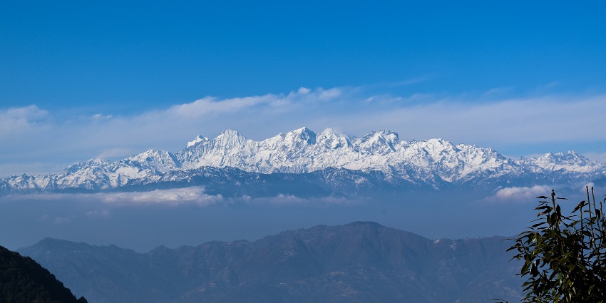 The stunning view of majestic, snow-capped mountains on a clear blue sky day in Nepal.