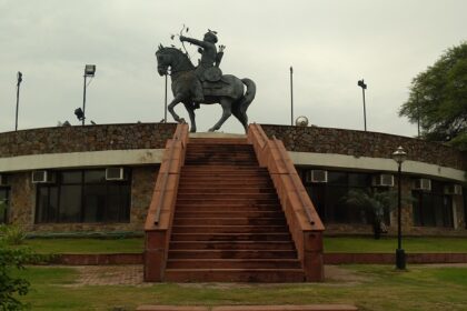 Explore Prithviraj Chauhan fort with a majestic backdrop, attracting tourists.