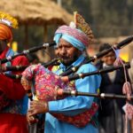 People performing to the tunes of the Punjabi music played on the instruments.