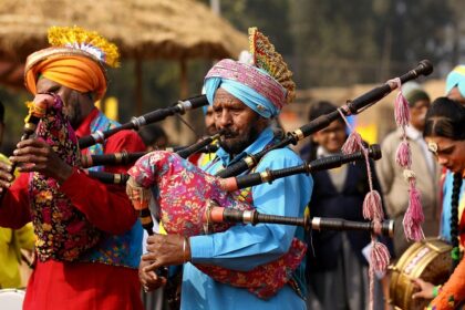 People performing to the tunes of the Punjabi music played on the instruments.