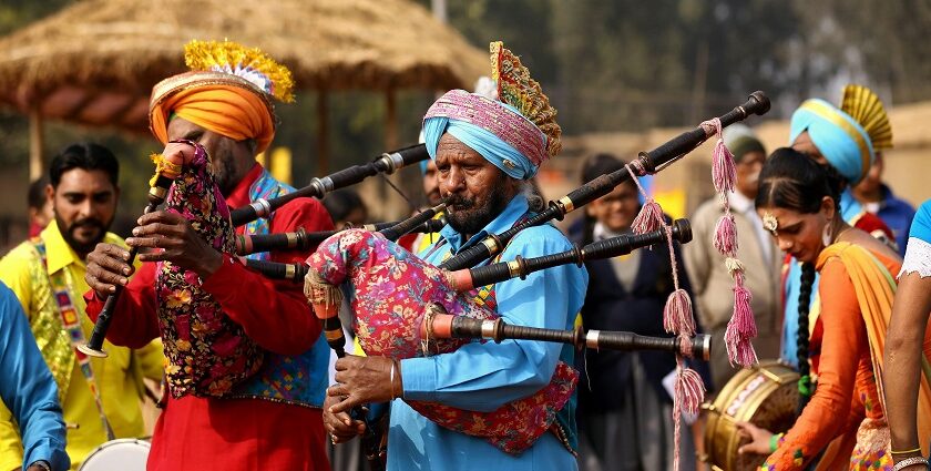 People performing to the tunes of the Punjabi music played on the instruments.