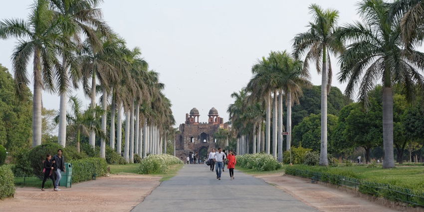 Image of entrance in Purana Qila - people are exploring and coming out of the Qila
