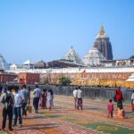 Visitors explore the vast grounds of Puri Temple