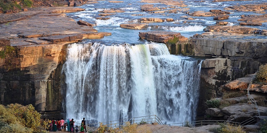 Explore the scenic Purwa Falls in Madhya Pradesh, cascading down rocks amid lush forest.