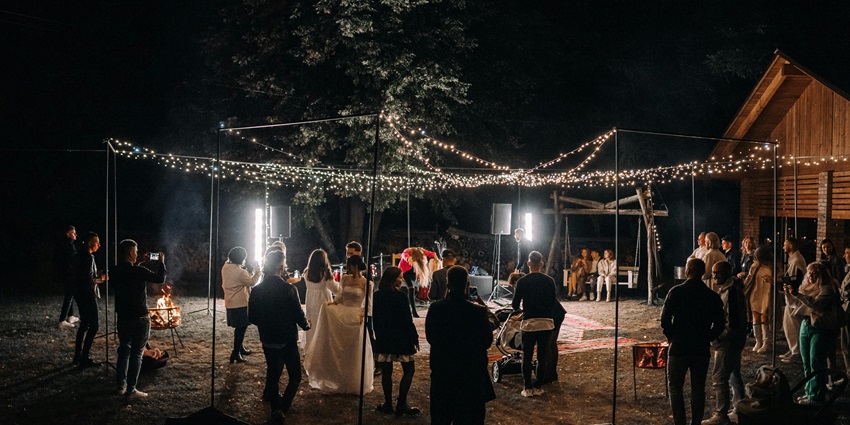 Indo-Western music evening with folk vocals, serene lake views, and eclectic instruments creating a peaceful yet vibrant soundscape.