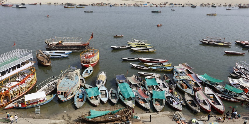 A bird’s eye view of the bustling Pushkar Ghat decked with colourful boats and more.