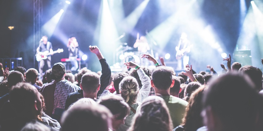 A picture of a music festival with visitors enjoying the festive ambience