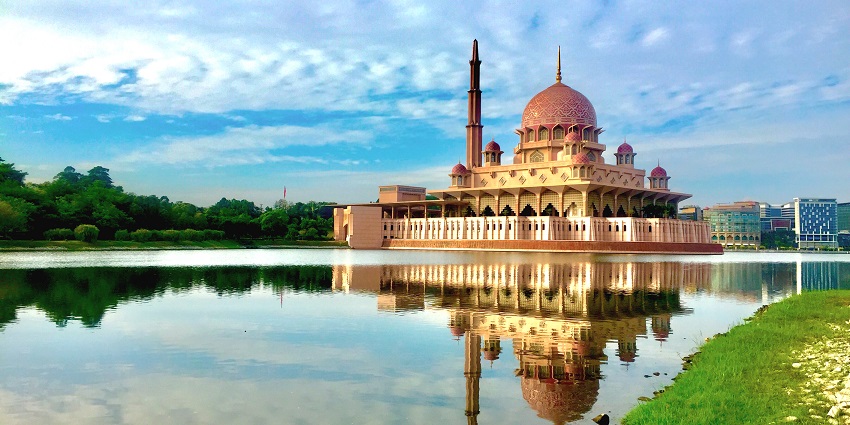 Lakeside view of the mosque, the majestic building reflecting into the sparkling water