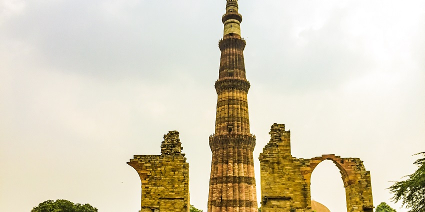 A picture of a UNESCO World Heritage site, Qutub Minar, located near Siri Fort, taken from its garden area
