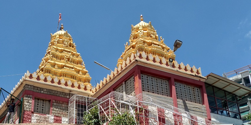 The view of Ragigudda Anjaneya Temple and its golden gopuram of the scared temple