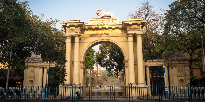 Grant gate at the entrance of the Raj Bhavan, surrounded by lush trees