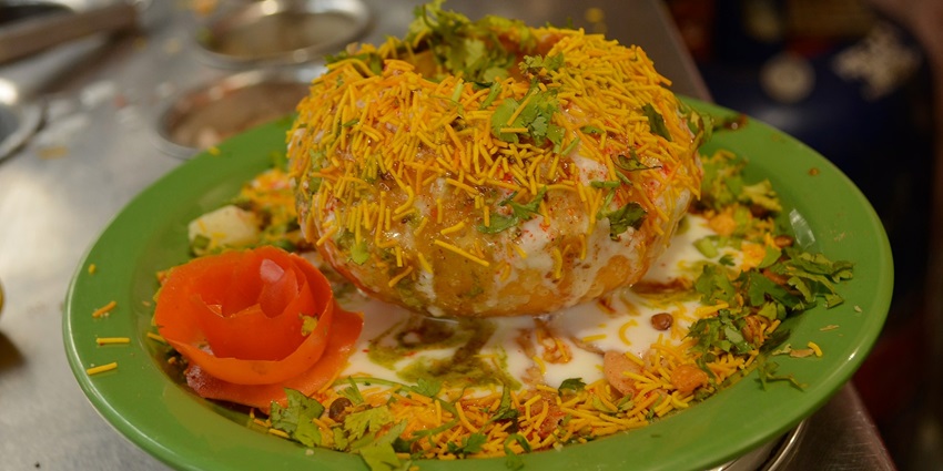 One of the best foods in Bikaner is Crispy Raj Kachori, served with tangy chutneys.