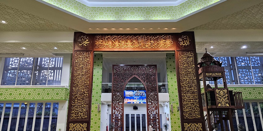 Futuristic green-certified mosque in Cyberjaya with geometric dome, energy-efficient design, and spacious interiors for community worship and events.