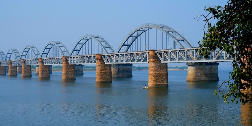 A breathtaking view of a along bridge passing over a body of water in Rajahmundry.