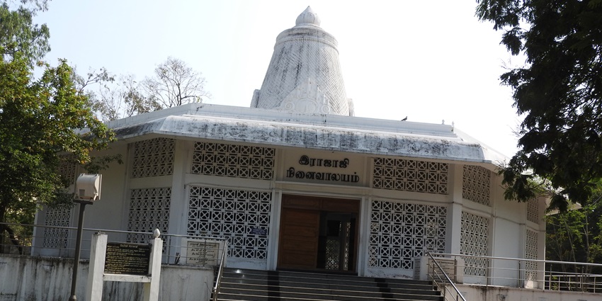 A picture of the Rajaji Memorial House taken from outside with views of its garden area