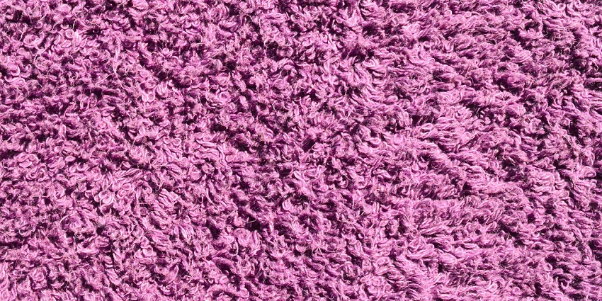 Close-up of a textured fabric showing detailed patterns and soft cotton material.