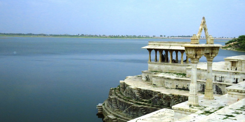 Historic ghat at Rajsamand Lake, showcasing ancient pavilions and intricate stone inscriptions.