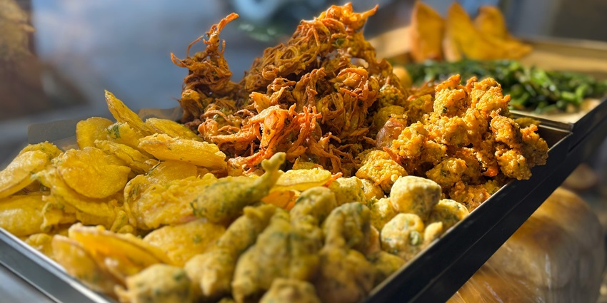A view of a variety of mustard-hued ram ladoo, one of the top street food in Lajpat Nagar.