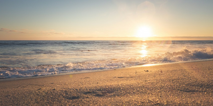 Enchanting view of a sunset at the beach, a perfect attractions for nature lovers to escape to