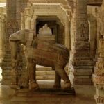 An inside view of a temple featuring a statue of elephant carrying God on its back.