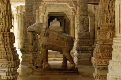 An inside view of a temple featuring a statue of elephant carrying God on its back.