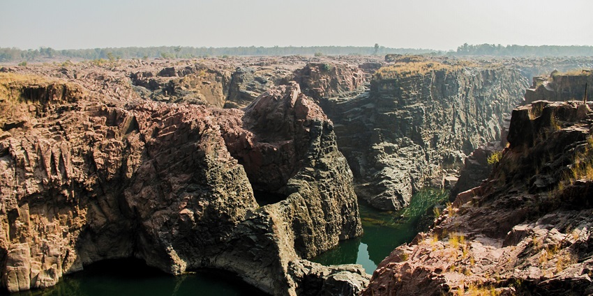 A breathtaking view of Raneh Falls, where a cascade of water flows over layered rock formations