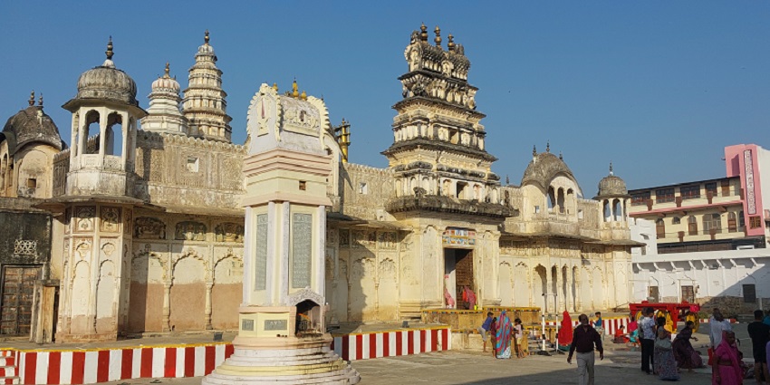 A picture of a historical temple in Rajasthan with a tall gopuram and intricate carvings