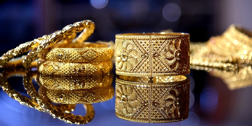 Intricate gold Indian bridal jewellery set, including necklaces and earrings, symbolising luxury and cultural shopping in Ahmedabad.